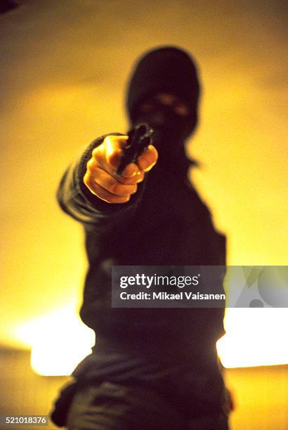 being held at gunpoint - balaclava gun stock pictures, royalty-free photos & images