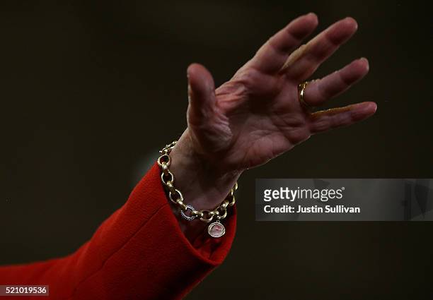 Democratic presidential candidate former Secretary of State Hillary Clinton wears a charm bracelet with an image of her granddaughter Charlotte...