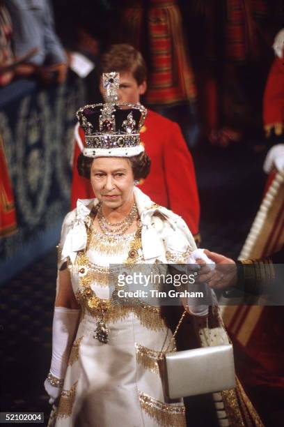 The Queen At The State Opening Of Parliament Processes Through The Royal Gallery On Her Way To The House Of Lords Wearing The Imperial State Crown...