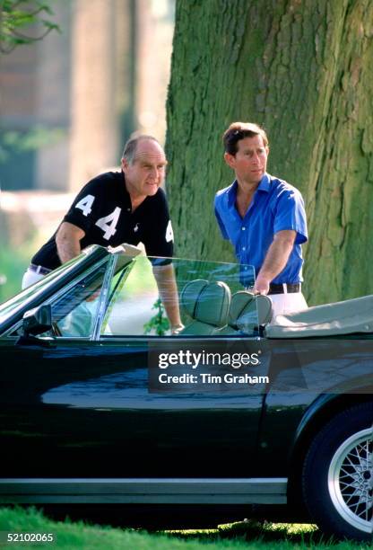 Prince Charles With His Polo Manager Ronald Ferguson At Cirencester Park Polo Grounds.prince Charles Is Standing By His New Green Aston Martin V8...
