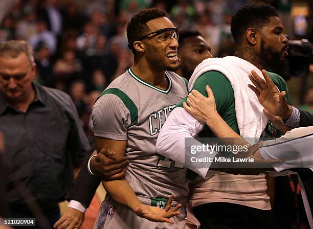 Evan Turner of the Boston Celtics reacts at the end of the third quarter against the Miami Heat as players from both teams receive technical fouls at...