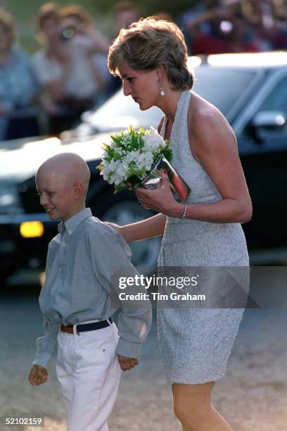 Princess Diana At The Serpentine Gallery In Hyde Park Receives Bouquet From Leukaemia Sufferer Thomas Waley-cohen.