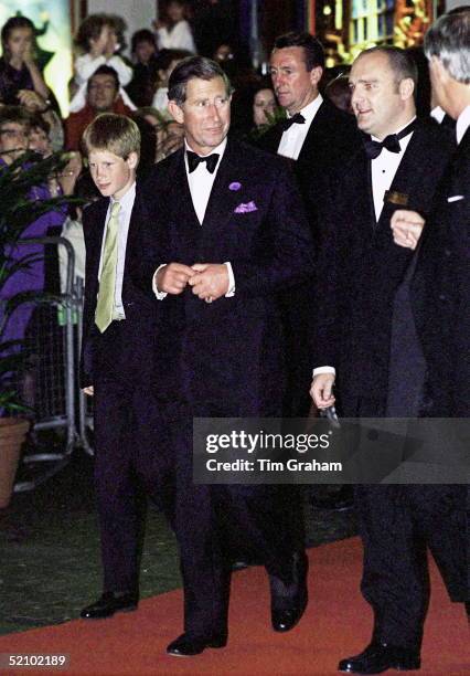 Prince Harry And Prince Charles Arriving At The Apollo Theatre In London To See A Performance Of 'doctor Dolittle'.prince Charles' Police Bodyguard...