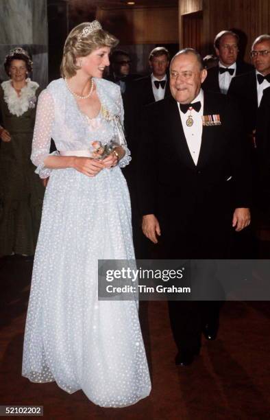 Princess Diana At Parliament House In New Zealand With Prime Minister Robert Muldoon. The Dress She Is Wearing Is Designed By Fashion Designers The...