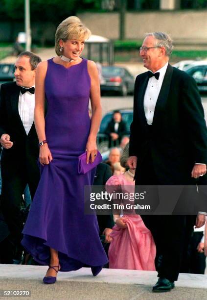 Princess Diana Arriving For Gala Dinner In Chicago In A Purple Dress Designed By Fashion Designer Versace And Shoes By Jimmy Choo.immediately Behind...