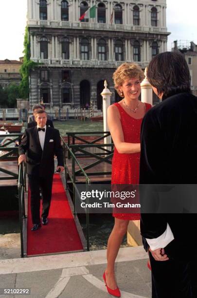 Princess Diana is greeted by her host, David Tang, as she arrives at the Peggy Guggenheim Museum in Venice for a reception in connection with the...