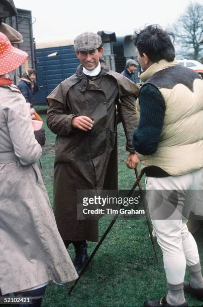 Prince Charles At The Fernie Hunt Cross Country Team Event Wearing Barbour Style /dryasabone Style Raincoat, Flat Cap And Walking Stick And Chatting...