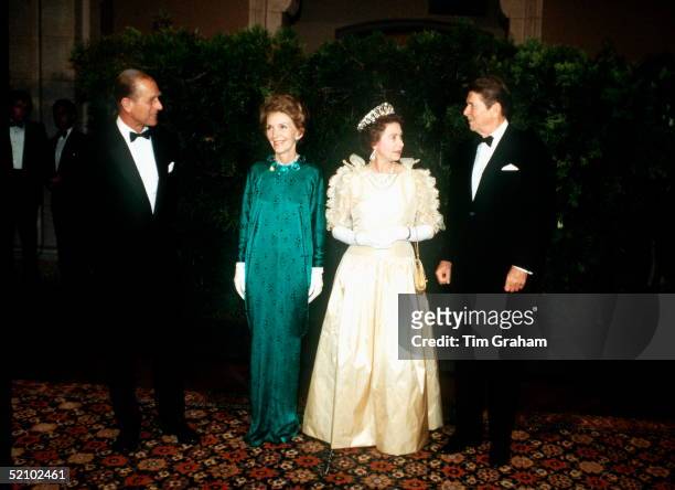 Queen Elizabeth II And Prince Philip With President Ronald Reagan And His Wife Nancy, The First Lady, Attending A Banquet During The Queen's Official...