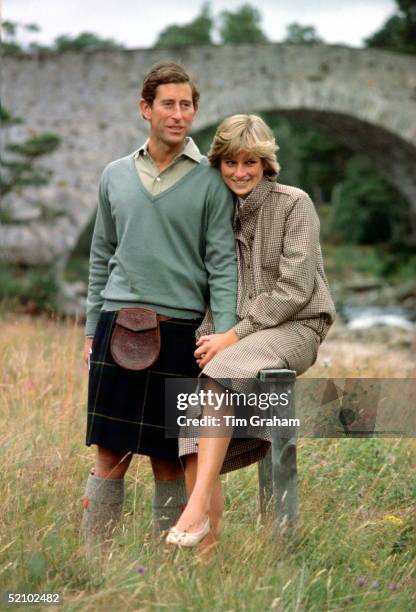 Prince Charles And Princess Diana Holding Hands And Smiling As They Pose During A Honeymoon Photocall By The River Dee. The Princess Is Wearing A...