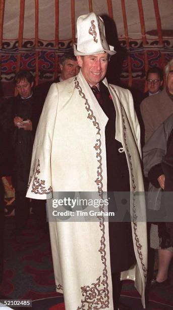 Prince Charles Wearing A Nomad's Costume During A Visit To Kyrgyzstan. Watched By His Police Bodyguard Colin Trimming