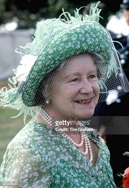 The Queen Mother Attending The Sandringham Flower Show. She Is Wearing A Green And White Floral Print Dress With A Matching Hat Decorated With Pale...