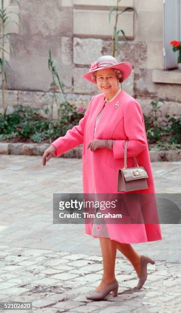 The Queen On A Visit To Blois In France Wearing A Pink And Taupe Outfit Designed By Fashion Designer Ian Thomas With Colour Co-ordinated Taupe Shoes...