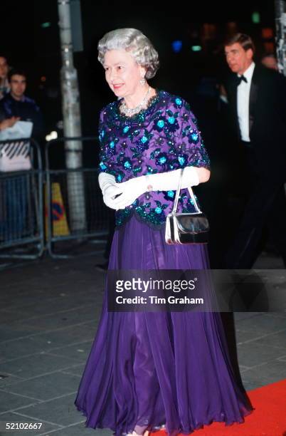 The Queen Arriving At The Dominion Theatre For The Royal Variety Performance. She Is Wearing A Dress By Fashion Designer John Anderson