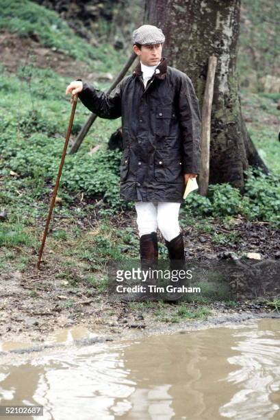 Prince Charles At Cross Country Event Wearing A Green Barbour Style Waxed Jacket And Flat Cap