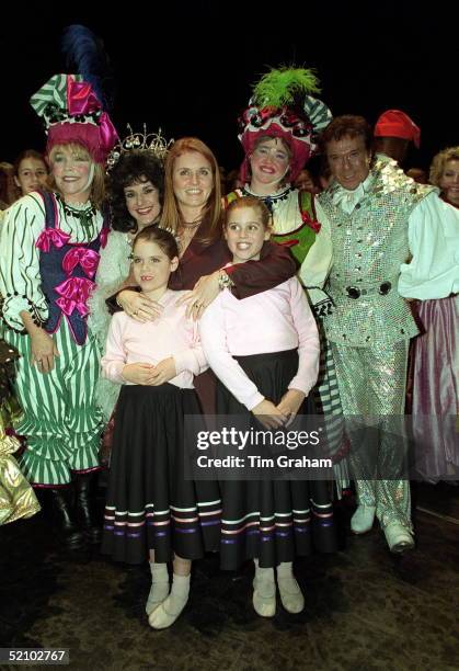 The Duchess Of York With Her Daughters, Princess Beatrice And Princess Eugenie At A Christmas Extravaganza At The Theatre Royal In Drury Lane, London...