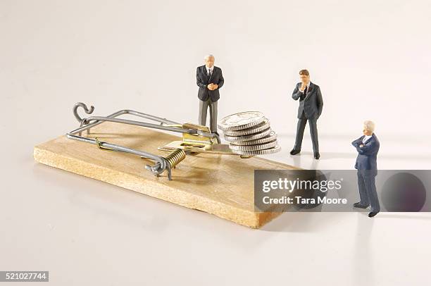 businessman figurines pondering mousetrap - mousetrap stock pictures, royalty-free photos & images