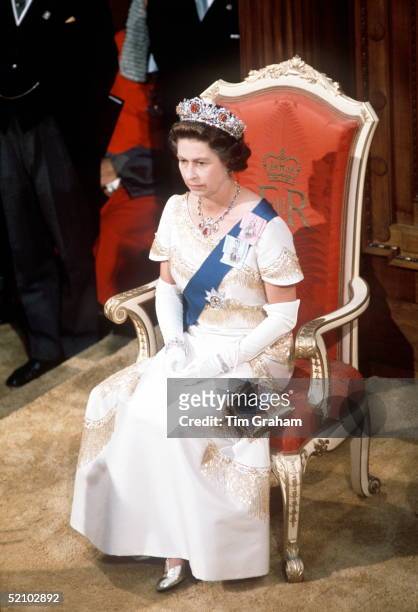 The Queen Sitting On Throne While Opening Parliament In Wellington, New Zealand, During Her Silver Jubilee Tour