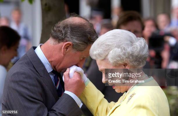 Prince Charles Kissing The Hand Of His Mother Queen Elizabeth When They Met At The Chelsea Flower Show.