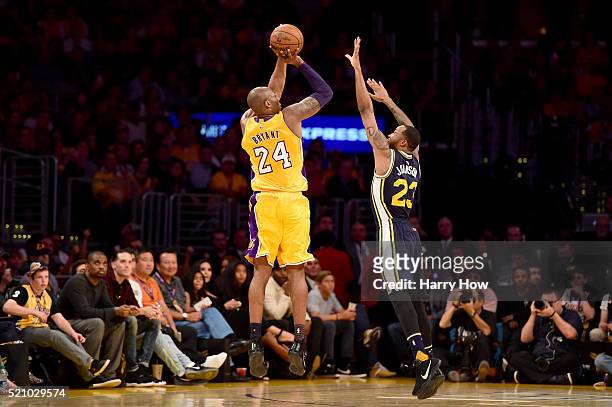 Kobe Bryant of the Los Angeles Lakers shoots over Chris Johnson of the Utah Jazz in the first half at Staples Center on April 13, 2016 in Los...