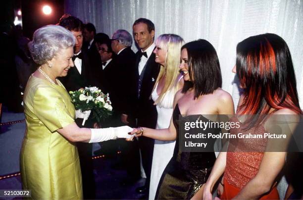 The Queen At The Royal Command Performance At The Victoria Palace Theatre On 1st December 1997 Shaking Hands With Pop Star Victoria Beckham Of The...