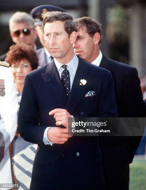 Prince Charles Tugging At His Cufflinks At Tumbalong Park, Sydney.