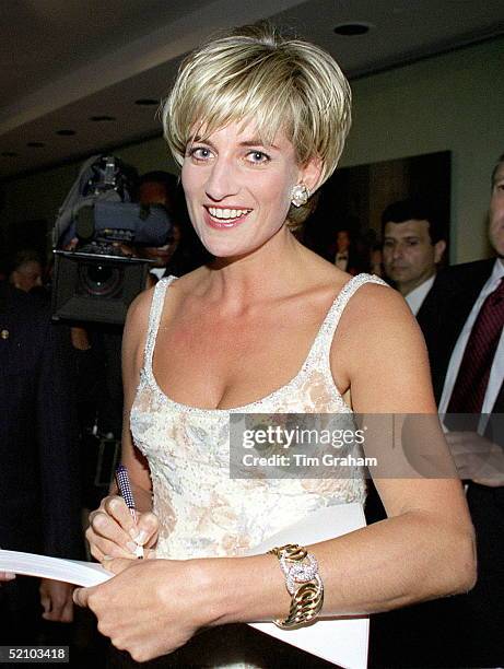 Diana Princess Of Wales Signing A Copy Of The Dresses Auction Catalogue At The Party At Christie's In New York To Launch The Dresses Auction.