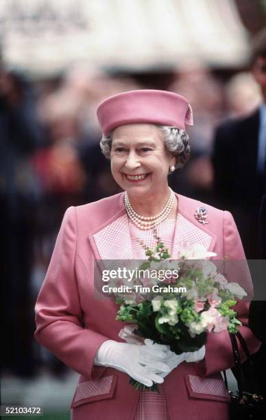 Queen In Leicester Square, London In Pillbox Style Hat.