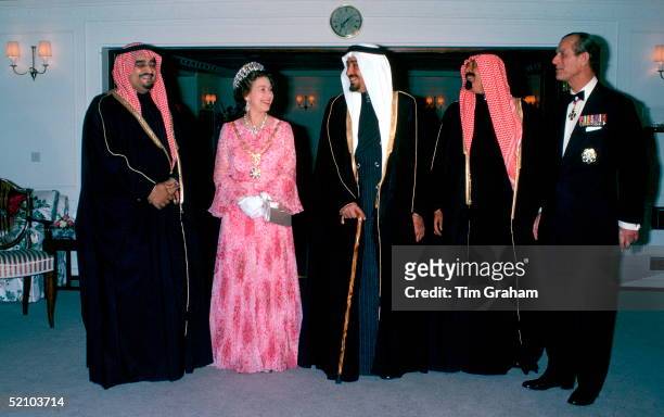 Queen Elizabeth Ll And Prince Philip On Board Hmy Britannia Host A Dinner For King Khaled The Crown Prince And Prince Abdullah During Their Official...