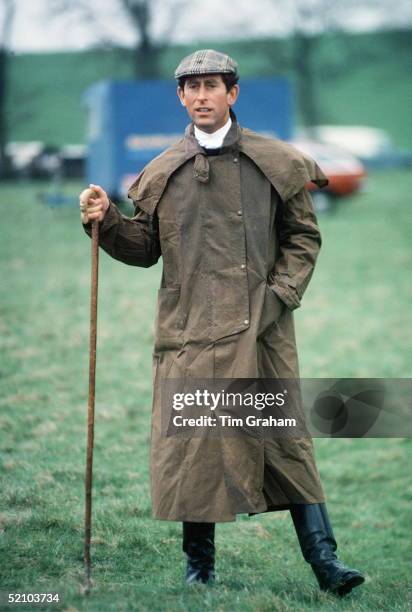 Prince Charles At The Fernie Hunt Cross Country Team Event Wearing Barbour Style /dryasabone Style Raincoat, Flat Cap And Walking Stick.