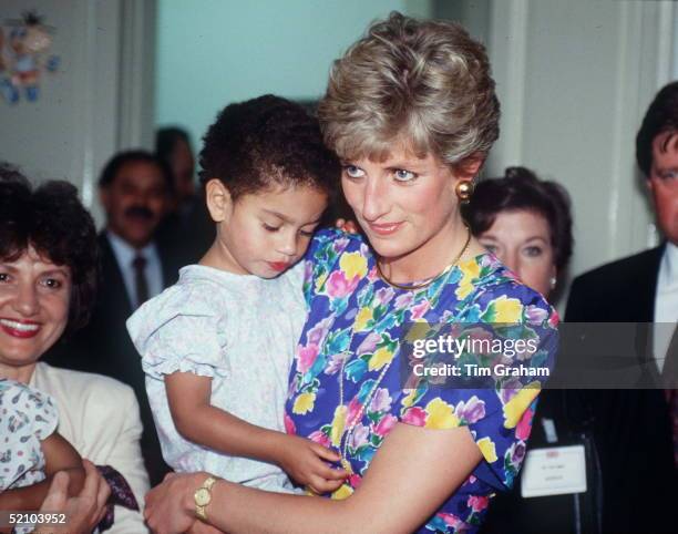 Princess Diana Holding A Young Child At Febem Hostel For Abandoned Children, Many Of Them Hiv Positive, In Sao Paulo, Brazil.