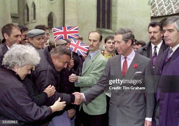 Prince Charles Shaking Hands With Members Of The Crowd That Have Gathered To Greet Him In The Medieval Town Of Sibiu In Transylvania. He Is...