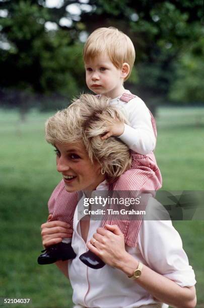 Princess Diana Carries Prince Henry On Her Shoulders At Highgrove.