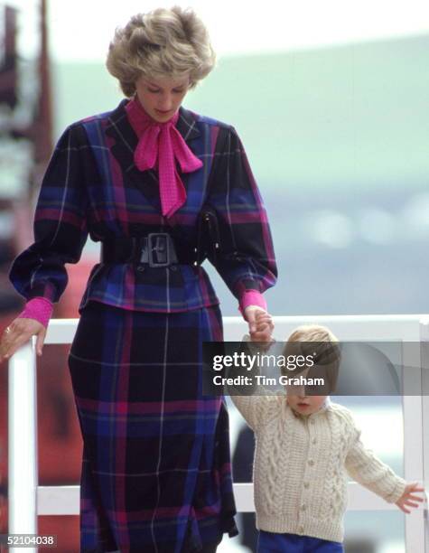 Prince William Leaving The Royal Yacht Britannia In Scotland With His Mother, The Princess Of Wales, After A Cruise Of The Western Isles. Diana Is...