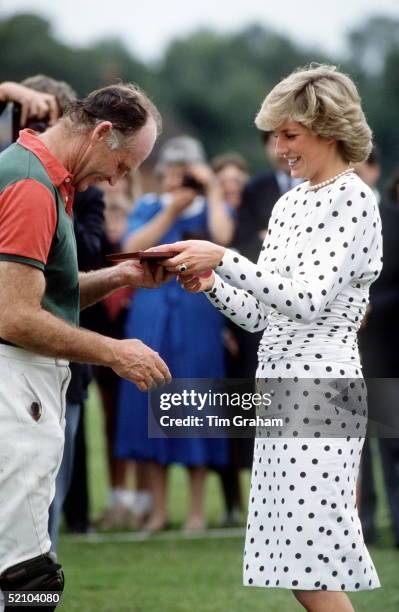 Princess Diana Presenting A Prize To Prince Charles' Polo Manager Ronald Ferguson At Polo, Windsor. Her Dress Is By Fashion Designer Victor Edelstein...