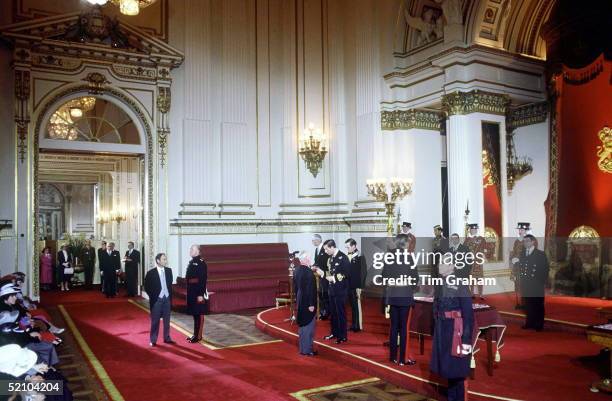 Prince Charles Holding An Investiture At Buckingham Palace