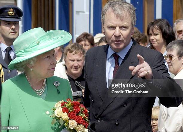 The Queen With Sir Robin Janvrin, Her Private Secretary During Her Visit To The Island Of Alderney, The Channel Islands.