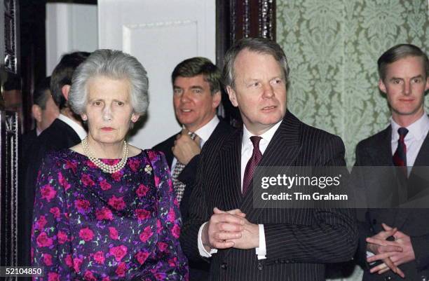 The Queen's Lady-in-waiting The Honourable Mary Morrison And Sir Robin Janvrin At The Commonwealth Day Reception At Marlborough House. In Between...