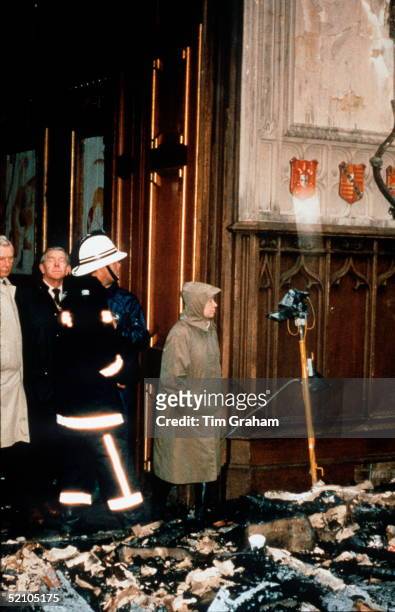 The Queen With Firemen Inspecting The Damage After The Fire At Windsor Castle.