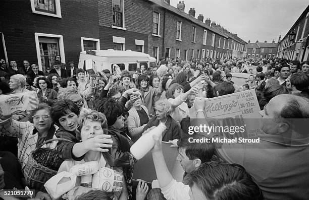 Irish women handing out food at a civil rights march in the Falls Road, Belfast, Northern Ireland.
