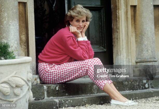 Diana, Princess of Wales sitting on a step at her home, Highgrove House, in Doughton, Gloucestershire, 18th July 1986.