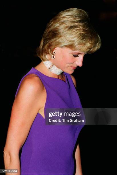 Diana, Princess Of Wales, Looking Pensive As She Leaves A Gala Dinner Held At The Field Museum Of Natural History. The Princess Is Wearing A Purple...
