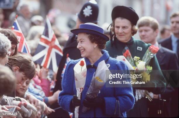 The Queen Attending The Maundy Service At Chichester Cathedral. She Is Receiving Flowers During A Walkabout With Her Lady-in-waiting, The Duchess Of...