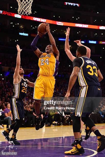 Kobe Bryant of the Los Angeles Lakers shoots against Raul Neto of the Utah Jazz in the fourth quarter at Staples Center on April 13, 2016 in Los...