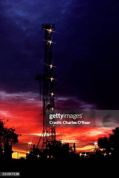 gas drilling at sunset - bakersfield stock pictures, royalty-free photos & images