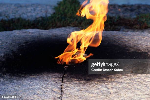 eternal flame at the john f. kennedy grave and memorial - eternal flame stock pictures, royalty-free photos & images