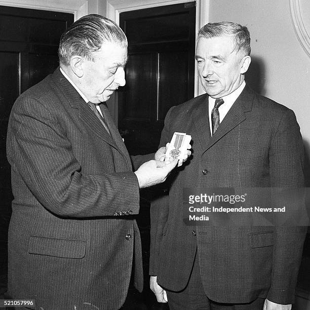 The Minister for Defence Mr Billiard T.D.presents the 1916 survivors medal to An Taoiseach Mr Lemass Govt.Buildings. 4/4/1966. 1916 anniversary's....