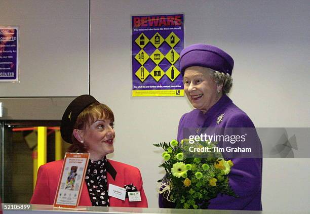 The Queen Laughing With A Ground Stewardess At The Opening Of The New Terminal At Luton Airport.