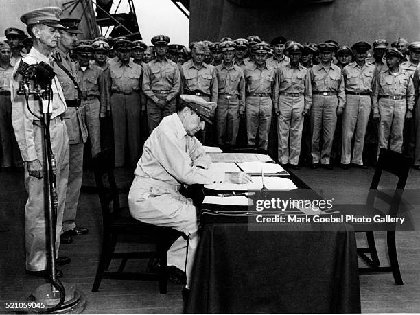 General Douglas MacArthur signing Japanese VJ, mid 1940s.