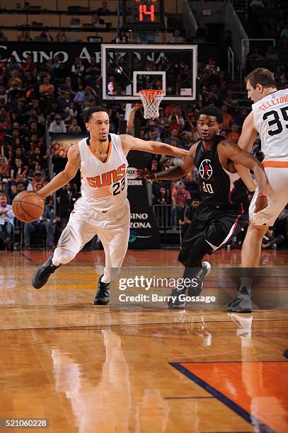 John Jenkins of the Phoenix Suns drives against C.J. Wilcox of the Los Angeles Clippers on April 13 at Talking Stick Resort Arena in Phoenix,...