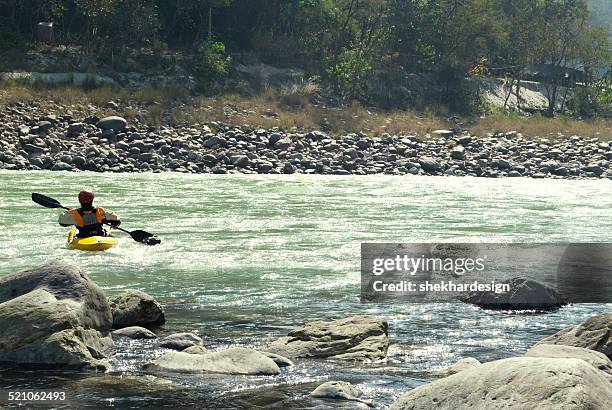 man rafting in river - rishikesh stock pictures, royalty-free photos & images